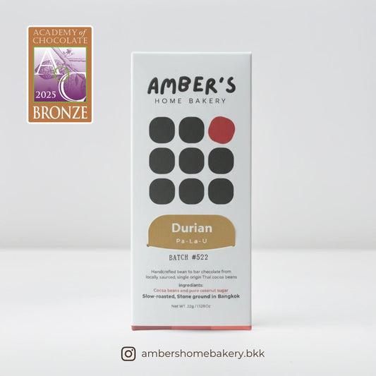 Amber's Home Bakery Durian Pa-La-U chocolate bar packaging with bronze award badge on a white background
